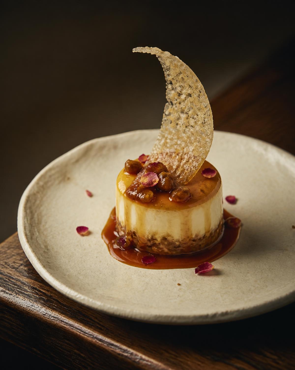 Burnt honey parfait with jujube caramel and rice tuile on cream ceramic